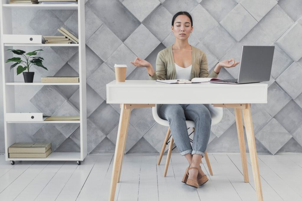 Woman at a desk finding work-life balance. 