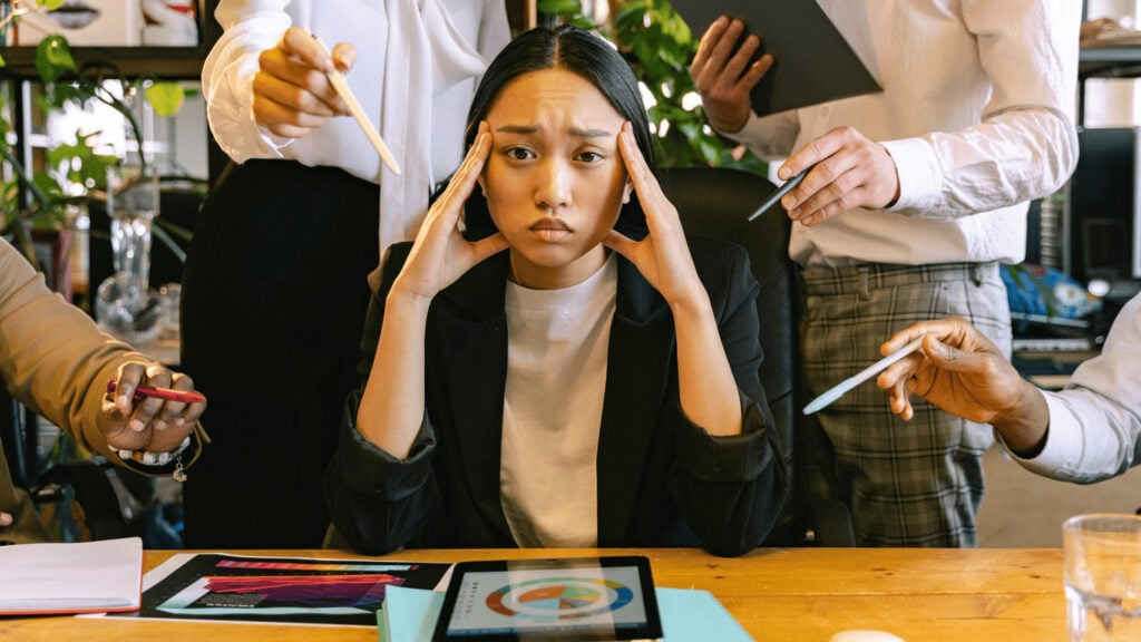Stressed employee under pressure, showing the impact of constant monitoring.